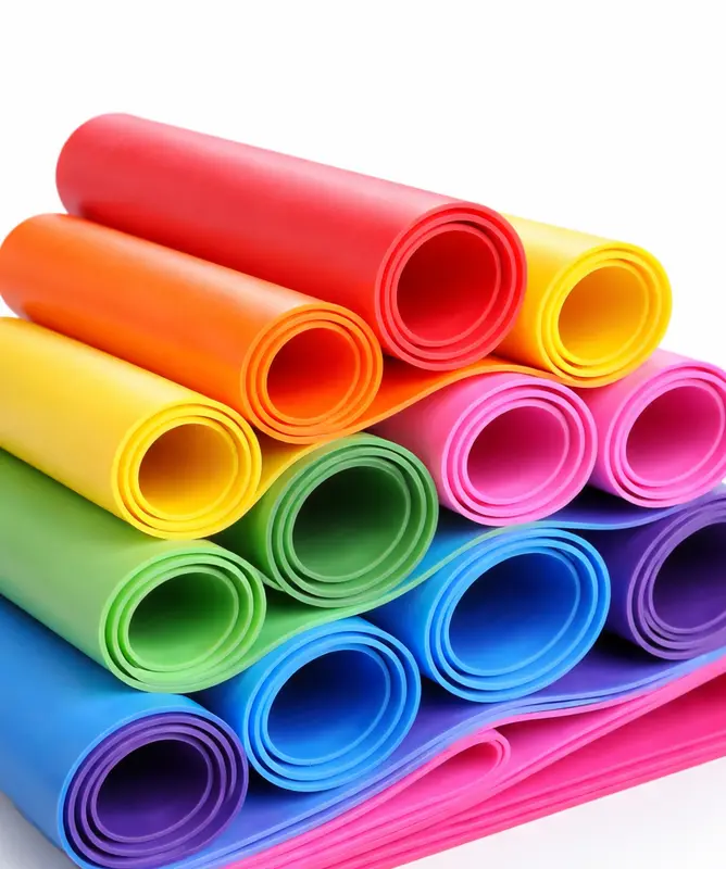 Colorful silicone rubber compounds rolled into cylinders, industrial material samples, clean white background, high detail, studio lighting. -Silicone Rubber Compound Suppliers. -1