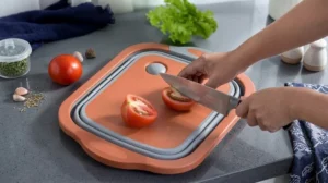 ilicone cutting boards featuring sliced fresh tomatoes on a sleek kitchen countertop.