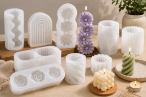 a set of candles, made by silicone candle molds, are placed on a table.