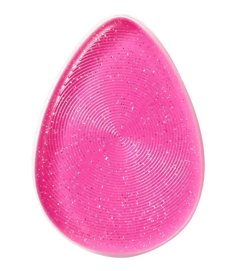 Pink silicone makeup blender with a textured, concentric-ring surface on a white background. - Silicone Makeup Blender 1