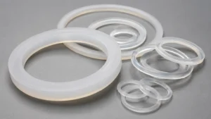 Silicone gasket rings in different sizes arranged on a grey surface - silicone gasket - 1