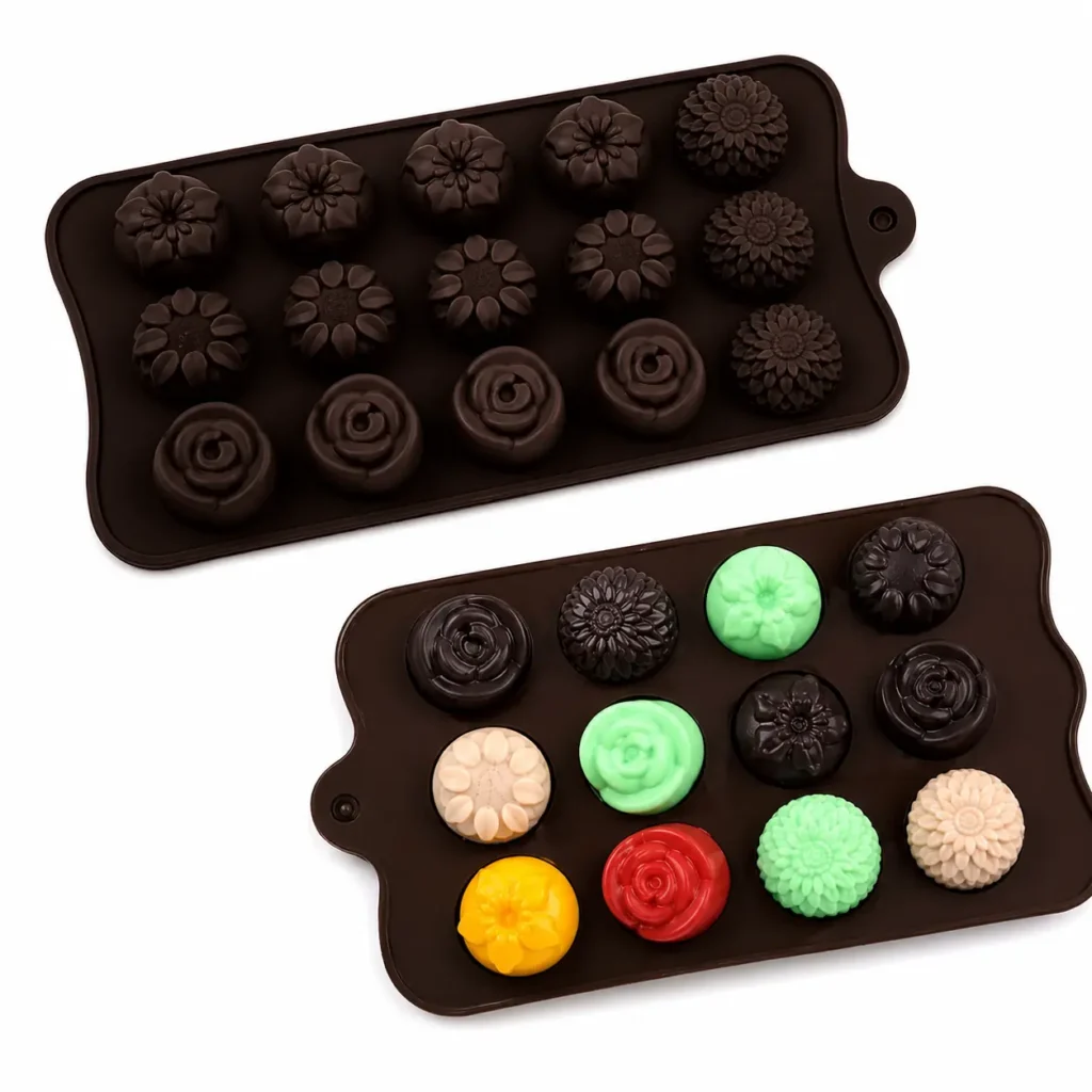 Dark chocolate silicone candy mold with colorful flower-shaped candies on a white background