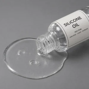 Clear silicone oil bottle pouring silicone oil on a grey background - silicone oil -1