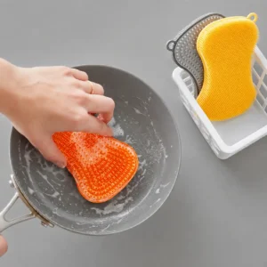 Orange and yellow silicone sponge scrubber on grey background - silicone sponge - 1