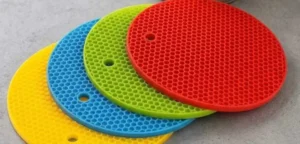 Colorful round silicone hot pads on grey counter - silicone hot pads- 1