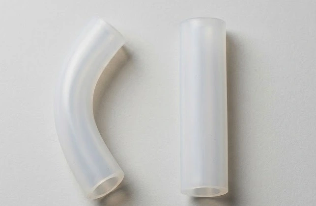 Two flexible translucent-white silicone sleeves on a light-grey surface - silicone sleeve - 1