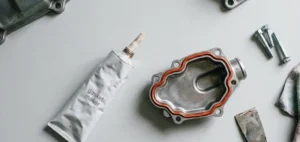 flat lay of tube and engine component - silicone gasket maker- 1