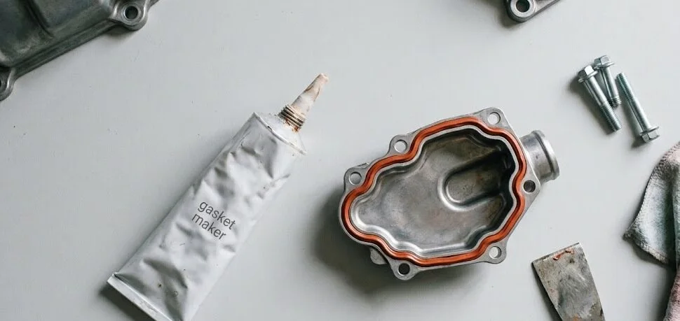 flat lay of tube and engine component - silicone gasket maker- 1